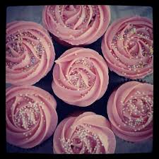 Vanilla Cupcakes With Strawberry Frosting With A Rose Tip And White And Pastel Sprinkles Strawberry Frosting Strawberry Cupcakes Vanilla Cupcakes