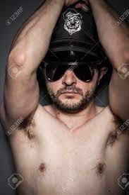 Naked, Good Looking Policeman, Sexy Police With Sunglasses Over Dark  Background Stock Photo, Picture and Royalty Free Image. Image 26289343.