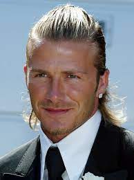 This is the kind of style that you can wear going surfing or out to a friend's wedding. David Beckham In Long Hair