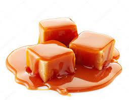 Caramel candies and caramel sauce Stock Photo by ©magone 60190259