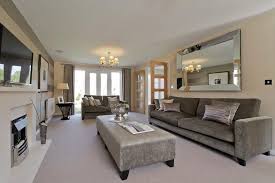 A long, narrow living room with a fireplace at the far end. How To Decorate A Narrow Long Living Room Novocom Top
