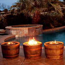 Handmade wine barrel fire pit that also functions as a table when not being used as a fire pit. Whisky Fire Barrel Whisky Barrel Outdoor Fire And Patio Your Direct Source For Outdoor Living Ne Wine Barrel Fire Pit Barrel Fire Pit Fire Pit Backyard