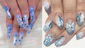 Butterfly Nail Art Is The Most 90s Manicure Trend For Fall Allure You can recreate nails in a delicate these coffin nails feature different glossy, light blue colors with two glitter accent nails.