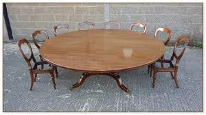 Spanning almost five feet, the circular dining table can seat up to eight people in style. Large Round Dining Table Seats 12