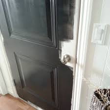 Its never been painted since we've black paint seems to bring out the roller marks…. Black Mudroom Door The Wood Grain Cottage