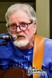 Grandson enjoying a spin in the singer