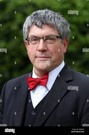 In this Friday, May 10, 2019 photo, businessman John Rallo, right, and his  lawyer John Rogers leave federal court in St. Louis after Rallo pleaded not  guilty to three counts of honest