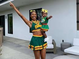 It must be gabrielle union's daughter, kaavia james union wade, in a clovers uniform! Gabrielle Union Twins With Daughter In Throwback Bring It On Cheerleader Costumes Gma