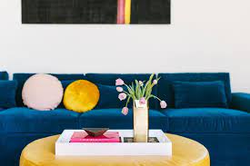 A bright luscious layer of cotton, this pouf offers a boost of buoyant energy to uplift your home. Modern Living Room Detail With Blue Velvet Sofa And Yellow Leather Ottoman Hgtv