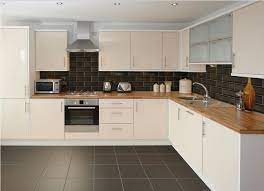 After sorting the tiles into warm and light whites, discards, and tiles that would still be usable if they were cut or hidden under cabinet trim, we gave the a few months in now, we still love the look of the tile. Cream Gloss Kitchen With White Tiles Novocom Top