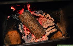 As the flame starts to become more robust, place a fire log or slab wood over top. How To Light A Fire In A Fireplace With Pictures Wikihow Life