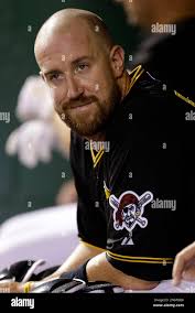 Pittsburgh Pirates catcher John Buck sits in the dugout during the fourth  inning of a baseball game against the Milwaukee Brewers in Pittsburgh  Thursday, Aug. 29, 2013. The Brewers won 4-0. (AP