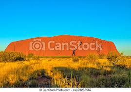 Alternatively, you can visit this area at dawn to capture the rock silhouetted against the rising sun. Uluru Ayers Rock At Sunset The Shadows Of Sunset In Dry Bush Vegetation Around Uluru Or Ayers Rock In Uluru Kata Tjuta Canstock