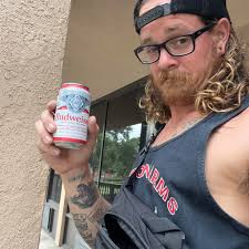 Looking for some advice, this will be getting 3 foot rib panels. Area in  question is where the arrow points. Should the 4/12 pitch roof go under the  valley metal? Should I