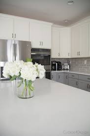 The kitchen pictured above combines classic all white cabinets with a warm gray kitchen island at the center. My Friends Gorgeous Gray And White Kitchen Cuckoo4design