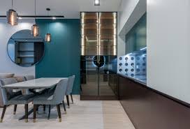 This display cabinet has a smooth surface with metal handles, and the design of the glass door makes the overall look more beautiful, which can complement your home decoration. Interior Contemporary Dining Room With Glass Cupboard And Table With Chairs Free Stock Photo