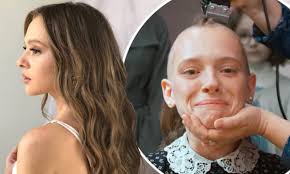 Slow motion view of lady pulling camo jacket up to cover her head. Unorthodox Star Shira Haas Recalls Shaving Her Head On The First Day Of Filming And Learning Yiddish Daily Mail Online