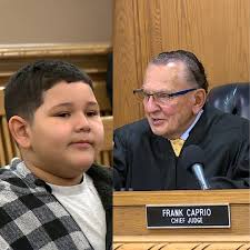 A mother appeared Judge Caprio's court accompanied by her 6-year-old son.  Always one to connect with the younger visitors in his courtroom, the Judge  turned to the boy and asked what he