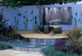 Water spills over a brick wall, encircles the patio, flows underneath the breezeway and empties into a fish pond. Icwfg44 Incredible Contemporary Water Feature Garden Finest Collection Hausratversicherungkosten Info