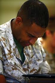 Lt. Col. Gilbert A. Warner bows his head during the