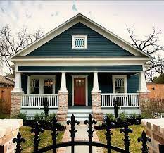 Trim is called out in a creamy white and windows are painted a deep red wine hue to tie in with the stained wood entry door. Pin On Curb Appeal