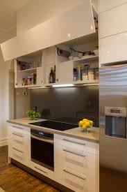 Modern Galley Style Kitchen Lift Up Overhead Cupboards By Blum Www Thekitchendesigncentre Com Au The Kitchen Design Centre Home Decor Kitchen Kitchen Design