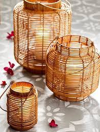 Handcrafted Rattan Lanters Help Set A Moody Ambiance While Dining Al Fresco Make A Big Statement By Grouping Outdoor Candle Lanterns Candle Lanterns Lanterns