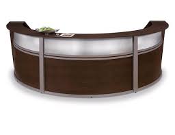 Front desk receptionist and scheduler greeting patients with friendliness and professional caring to ensure their visit is as pleasant as possible. Choosing The Right School Reception Desk School Furniture Blog