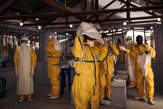 Health workers putting on their personal protective equipment (PPE) before  entering in the red zone of an Ebola Treatment Centre in the Democratic  Republic of Congo. Since last August, Ebola has inf