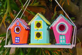 Once the birdhouses are finished, make an expedition out of installing them around your farm. Diy Birdhouse Christmas Village Made With Happy