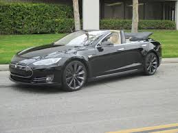 It stacks behind the rear seat in a big pile that blocks rear vision from the driver's seat. Tesla Model S Convertible First Drive