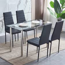 For a sleek, modern appearance, try a glass top dining room set with a clear pane resting on a metal base. Huiseneu Modern Glass Dining Room Table And Chairs Set 4 Black Kitchen Chairs Faux Leather With Rectangular Tempered Glass Table With Chrome Legs For Small Space 1 Table 4 Chairs Buy Online In