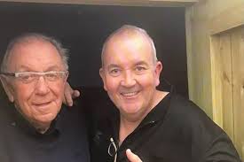 Phil Taylor feeding Robbie Williams' dad in heart-warming Christmas Day  gesture