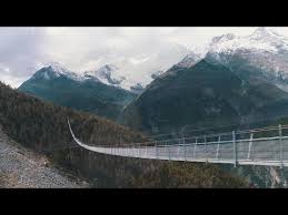 Longest Pedestrian Suspension Bridge Soars Over Swiss Alps Valley Youtube