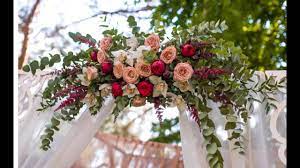 Turn a garden gate into a beautiful wedding arch. How To Make A Flower Swag Diy Wedding Arch Flower Decorations