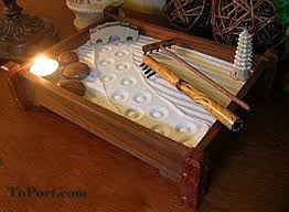 A mini zen garden is very soothing and can be arranged on every desk or coffee table. Love My Table Top Zen Garden The Kids And I Play With It All The Time Zen Garden Mini Zen Garden Zen Garden Diy