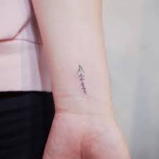 Lavender Sprig Tattoo On The Inner Wrist Lavender Tattoo Minimalist Tattoo Flower Wrist Tattoos