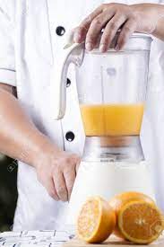 Chef Making Orange Juice Smoothie With Blender Stock Photo Picture And Royalty Free Image Image 50860736