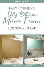But, sometimes we tend to skate by with whatever mirror frames or plain mirrors our home came with, even if it is just a lone reflective sheet. Diy Bathroom Mirror Frame For Under 10 Hello Hayley Blog