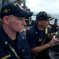 Cmdr. Charles Sargeant, commanding officer of the guided-missile destroyer  USS John S. McCain (DDG 56), delivers remarks during a change of command  ceremony.