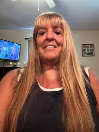 Which hair looks better for a 63-year-old woman: Long, Short, poofy, or  Straight?