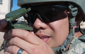 Pfc. Henry Kim trains with a compass during Operational