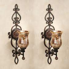 Whether the choice is a tiered look or single votive, wrought iron will maintain its luster for years. Wall Sconces Wall Candleholders And Wall Candelabras Candle Wall Decor Candle Wall Sconces Candle Holders Wall Decor