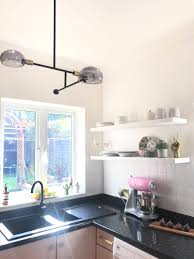 Vinyl overlay produces a stylish, unique effect for far less cost than upgrading major appliances. My Big Pink Budget Kitchen Makeover Reveal From Dingy And Dated To Bright And Bang On Trend Gold Is A Neutral