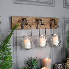 Because there's often not space for a floor lamp, wall lighting opens up the hall for more furniture. Rustic Wall Mounted Hook Tealight Holder Flora Furniture