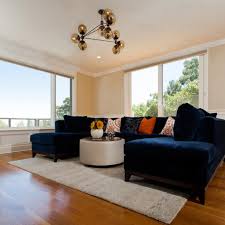 But the navy blue sofa can also be at the heart of the rustic living room in white and wood, shabby chic living space clad entirely in white or even that posh, contemporary home with a sophisticated living space. Photos Hgtv