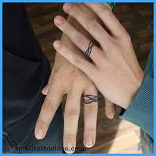 35 Unique Ring Tattoo Ideas Ring Tattoo Designs Wedding Tattoos Wedding Ring Tattoo