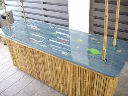 The top is made from reclaimed wood and rustic handles were added to the drawers. Image Result For Ideas For Tiki Bar Counters Diy Outdoor Bar Outdoor Bar Outdoor Kitchen Design