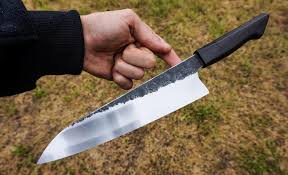 S-grind gyuto chef knife. Forged 52100 carbon steel blade concaved for food  release. Stabilized extra dark ancient bog oak handle. 218x54mm and 3.3mm  thick above heel tapering to 2.3 at end of