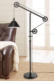 The Industrial Style Adjustable Pulley Floor Lamp Is Functional In Design And Will Make A Statement In A With Images Pulley Floor Lamp Floor Lamp Design Rustic Floor Lamps